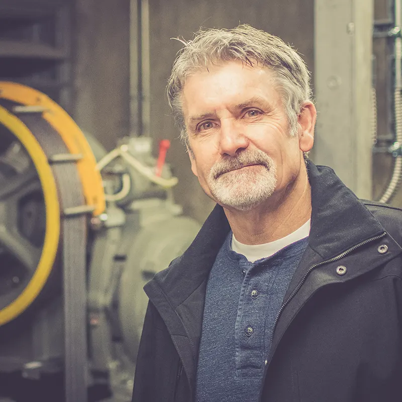 Glenn Zolnierczyk in an elevator machine room